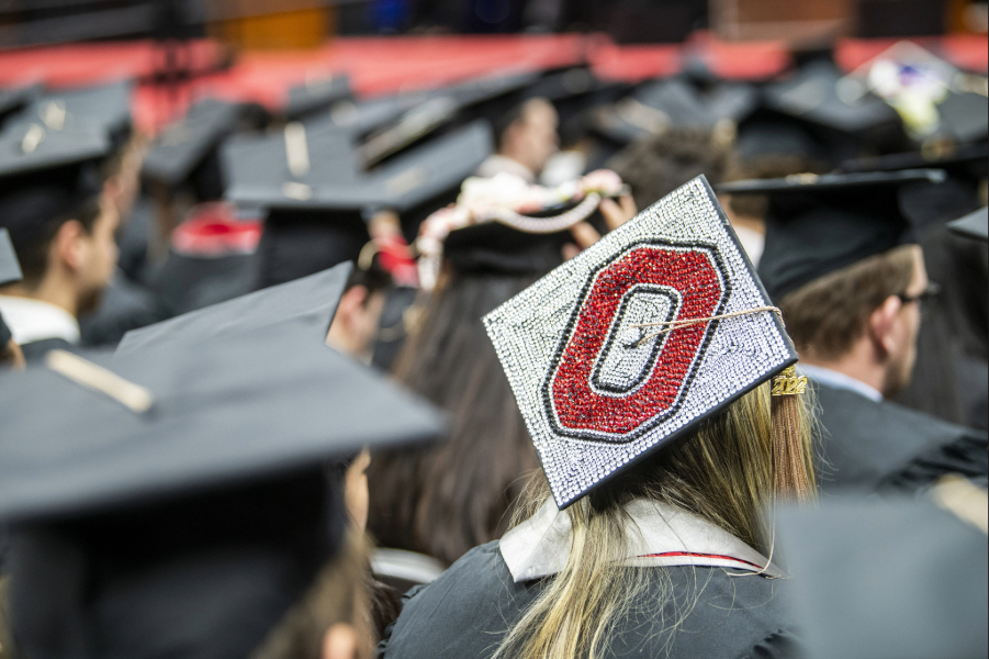 Autumn commencement at the Schottenstein Center, students graduating, Block O mortarboard