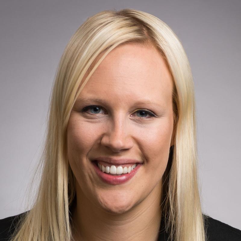 Professor Hollie Nyseth Brehm, white female smiling at camera wearing black blazer, long blond hair