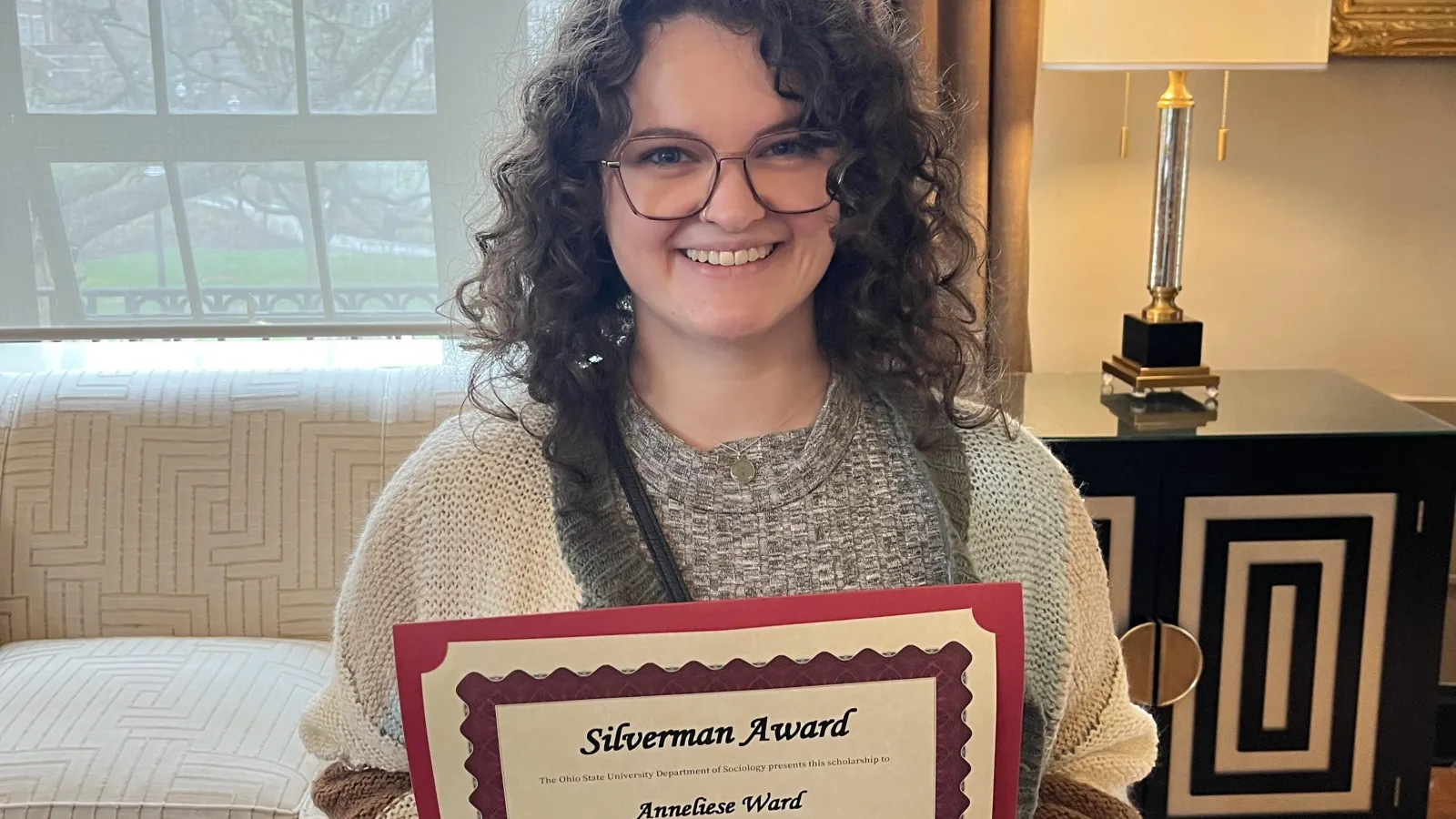 Anneliese at the Spring 2025 Department Awards with her Silverman Award Certificate