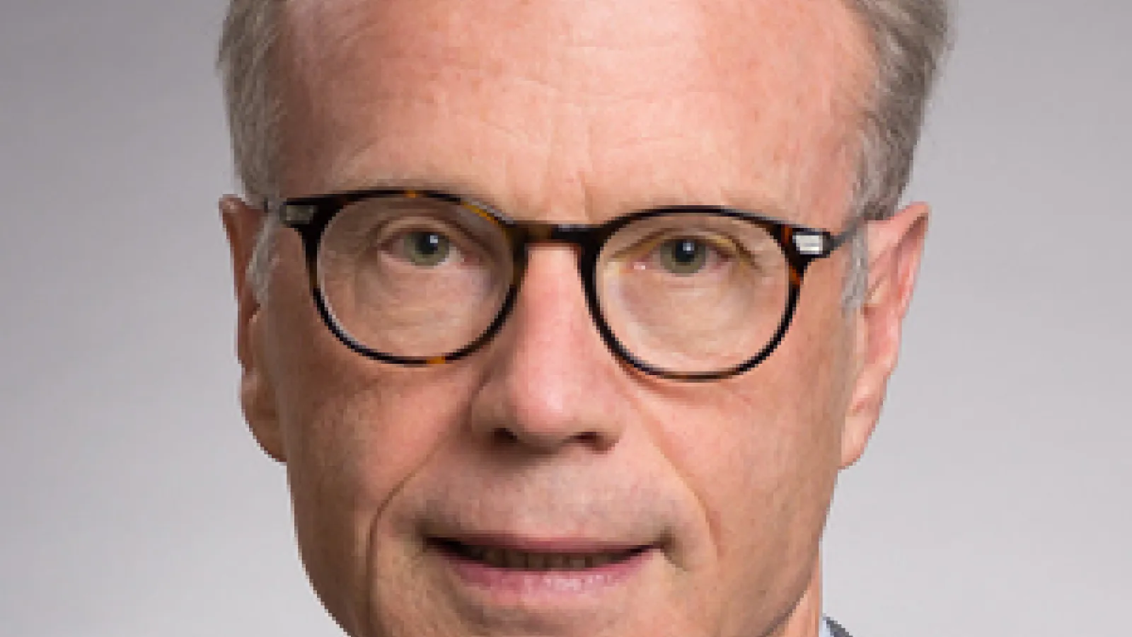 White man smiling at camera