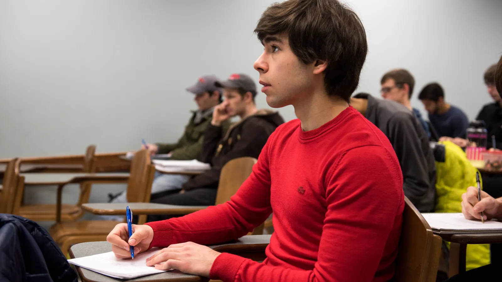Young man taking notes