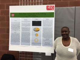 Amber Hamilton at the Denman Research Forum Photo of Ms. Hamilton with her research presentation