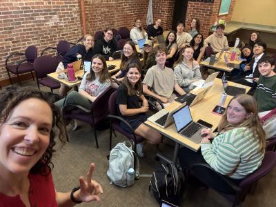 Professor Danielle Schoon with the Ohio State COIL students working at desks