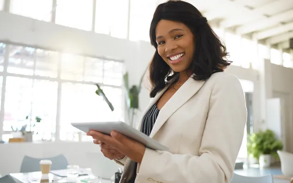 Woman holding clipboard in office environment