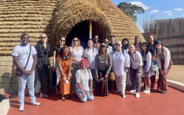 Group of study abroad students and faculty member, Hollie Nyseth Nzitatira, in Rwanda