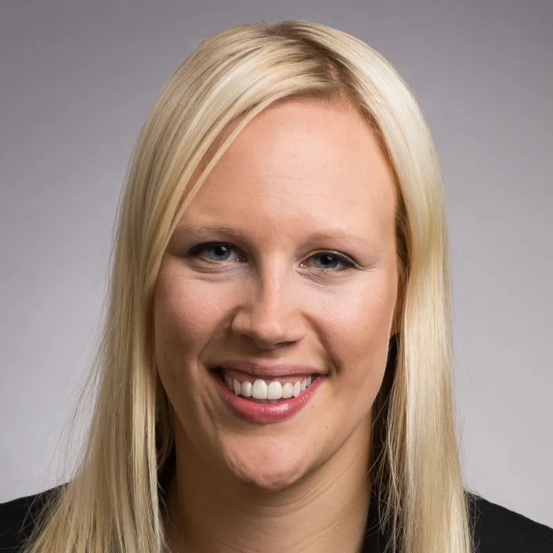 Professor Hollie Nyseth Brehm, white female smiling at camera wearing black blazer, long blond hair