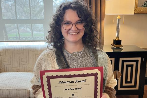 Anneliese at the Spring 2025 Department Awards with her Silverman Award Certificate