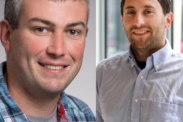 Image of two white men, smiling at the camera