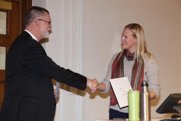 Holly Nyseth Brehm receiving the Alumni Distinguished Teaching Award Photo of Brehm reeving the award