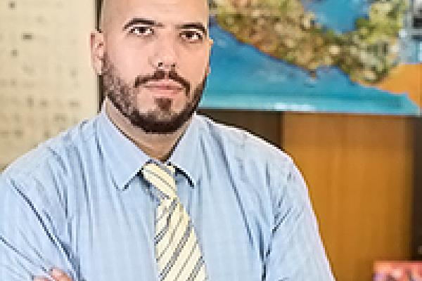 Professor Daniel Martinez, University of Arizona White man with arms crossed, looking at camera
